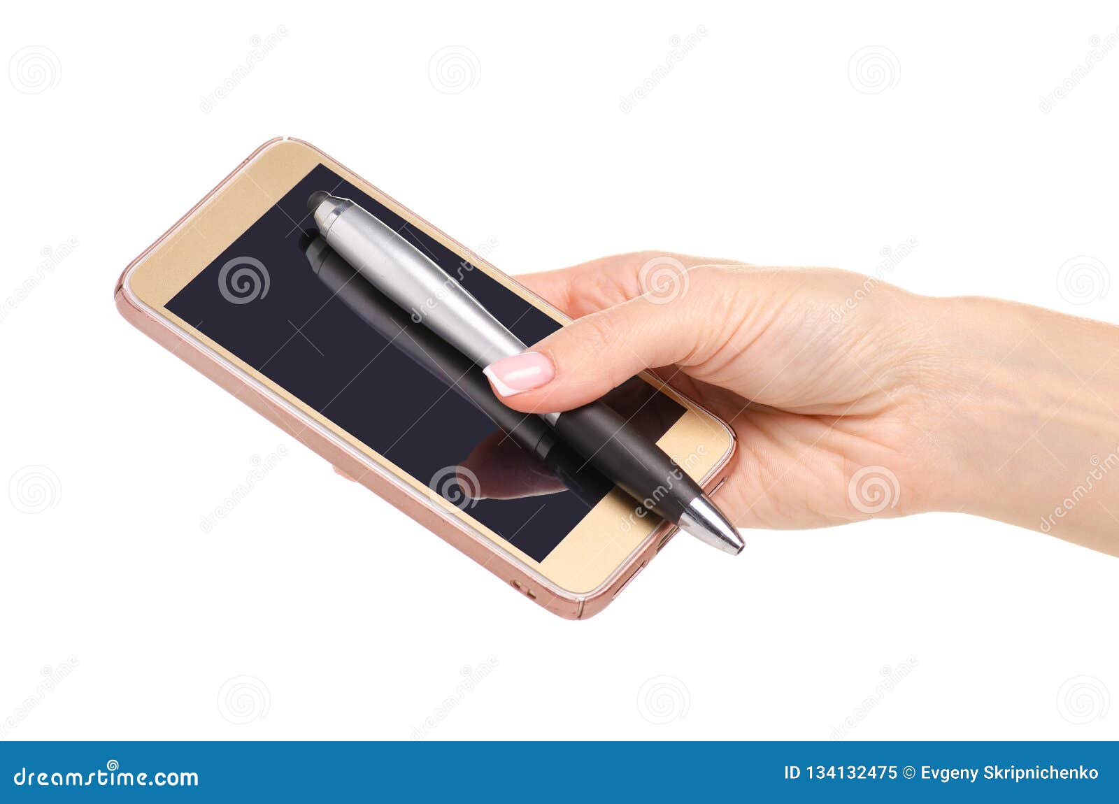 A hand holding a silver stylus pen touching the screen of a gold smartphone.