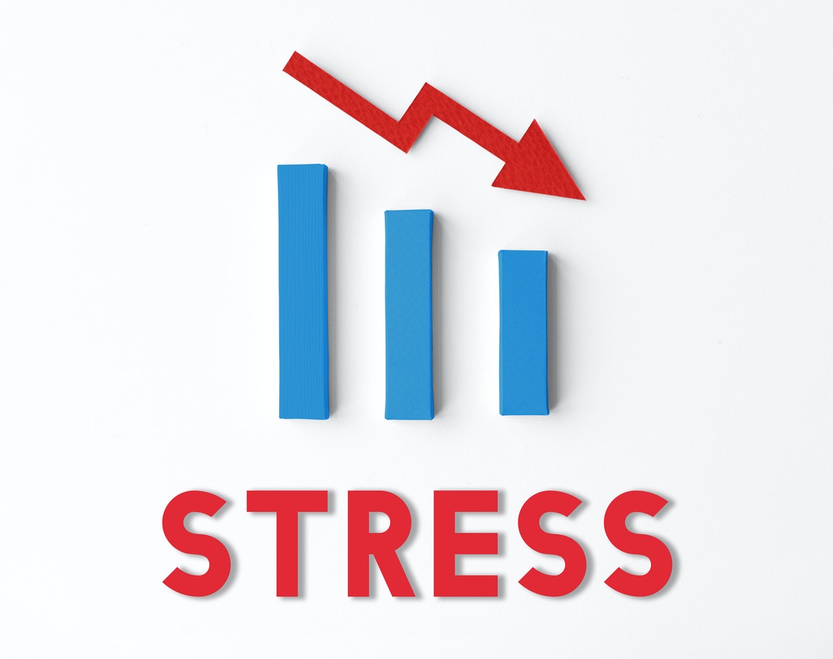 A red arrow points down at a blue bar graph representing stress while investing.