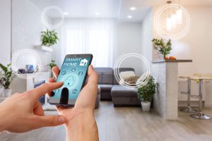 A person is using a smartphone to control smart home devices such as lights, thermostat, and door lock to save energy.