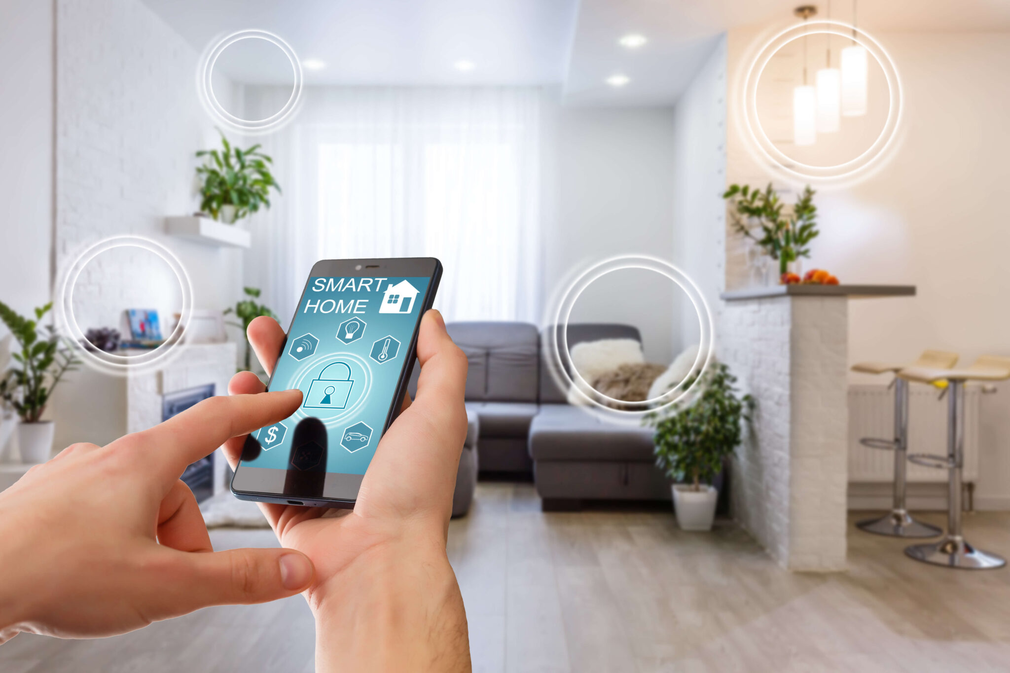 A person is using a smartphone to control smart home devices such as lights, thermostat, and door lock to save energy.