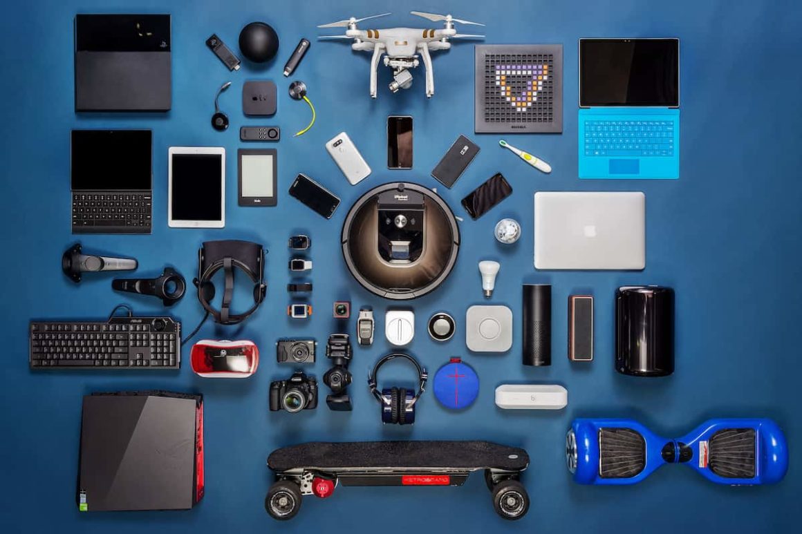 A wide variety of modern gadgets for everyday life are displayed on a blue background, including drones, virtual reality headsets, smart home devices, and more.