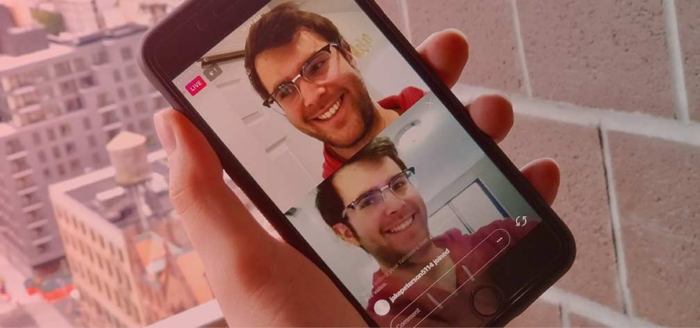 A person holding a phone with Instagram Live open, showing two people in a live video call.